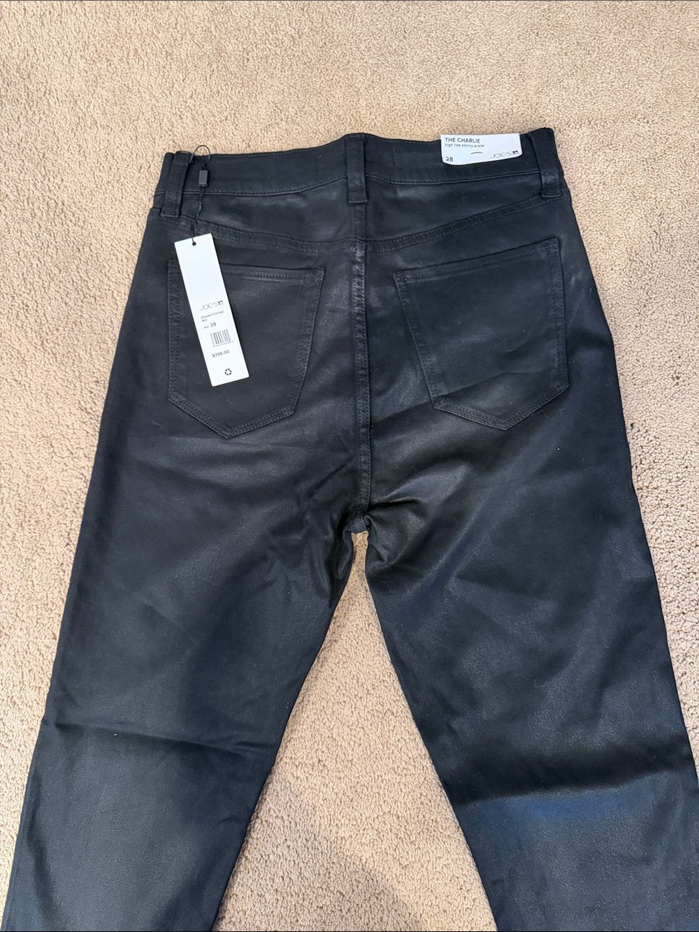 Joe’s women’s black coated jeans. The Charlie high rise skinny ankle.